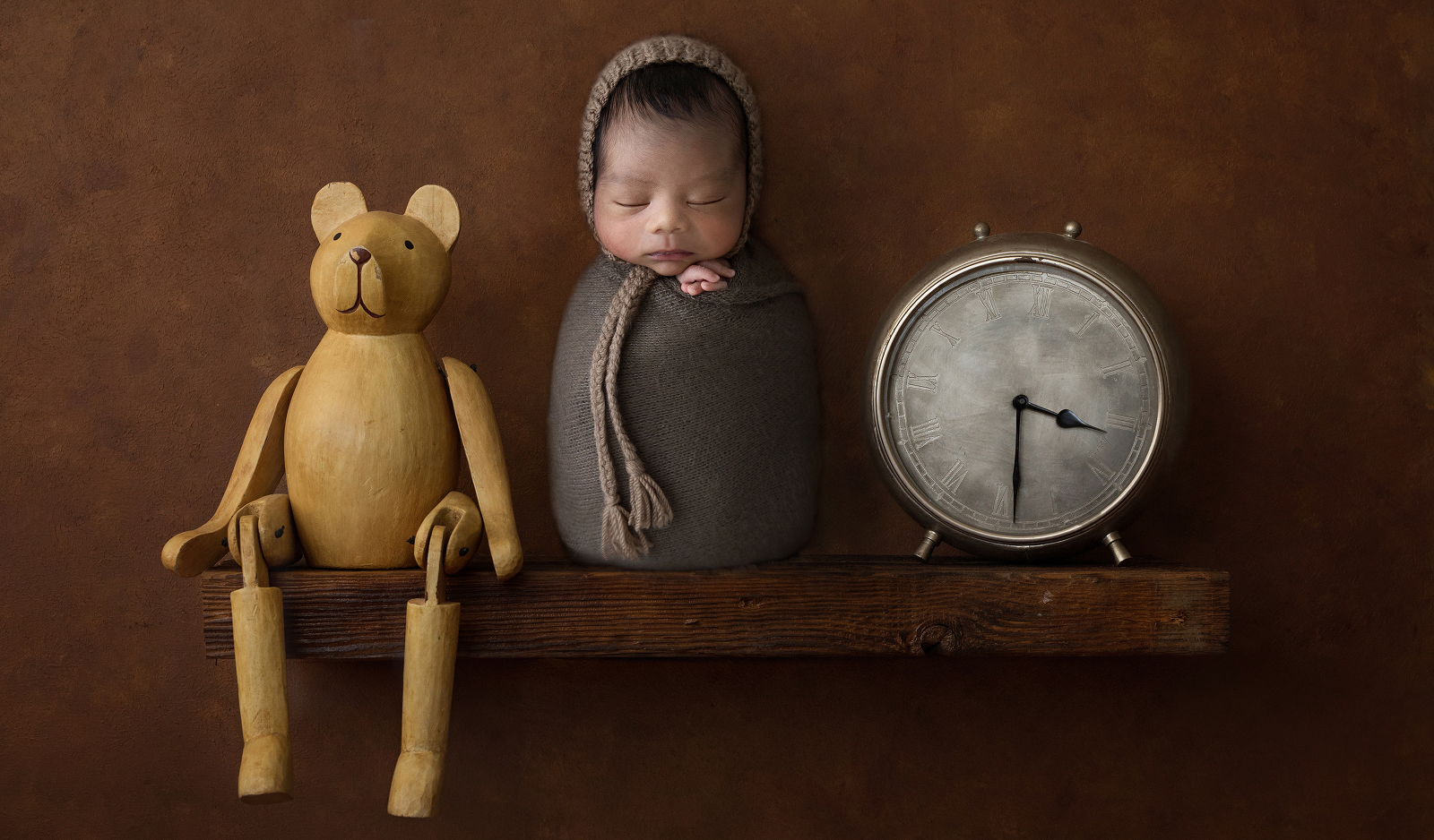 Darwin Photographer little cherub newborn baby, clock, teddy