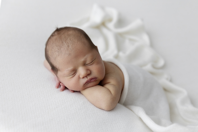 newborn darwin photograph baby on white background