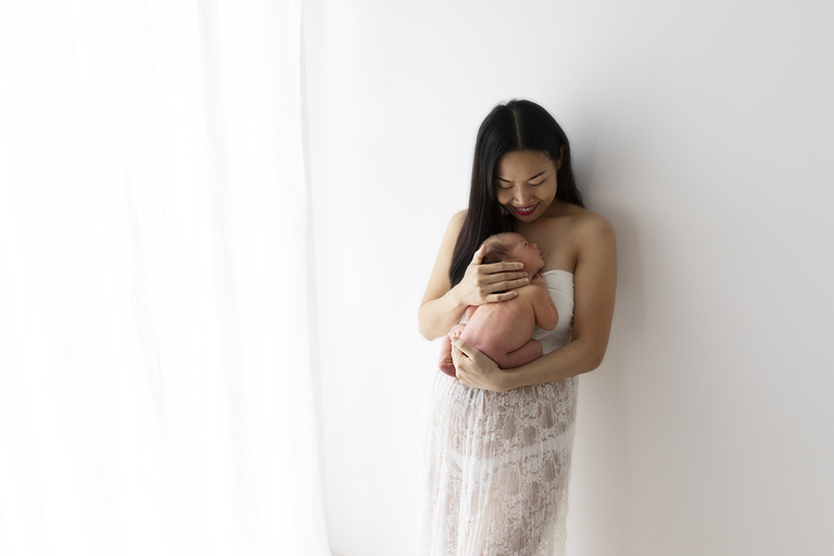 photograph of mother holding newborn baby darwin