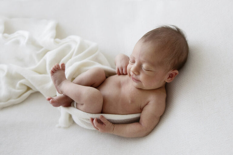 Newborn photograph darwin curled in white wrap