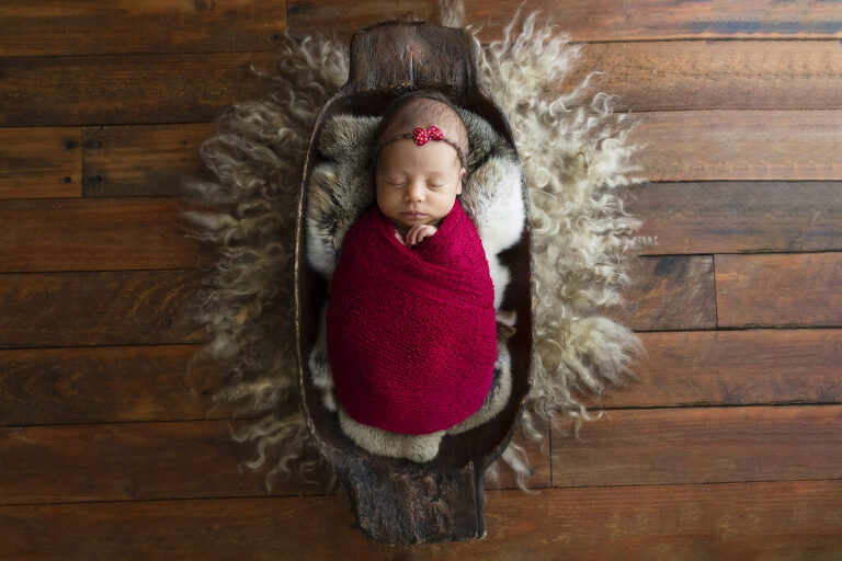 newborn baby in wood basket darwin photographer