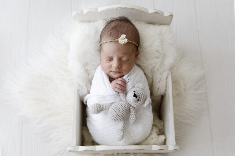 newborn baby photograph holding teddy darwin