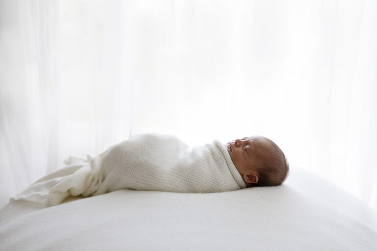 photograph of darwin newborn baby wrapped in blanket