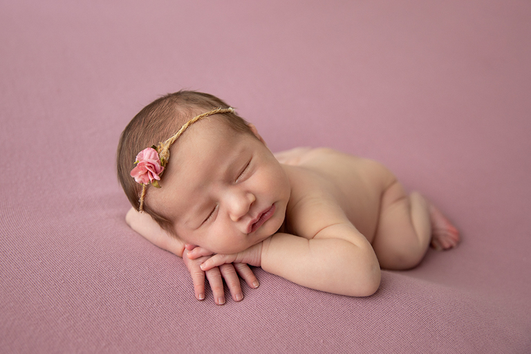 darwin newborn photograph of baby pink blanket flower headband