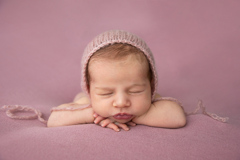photography newborn darwin baby on pink and bonnet